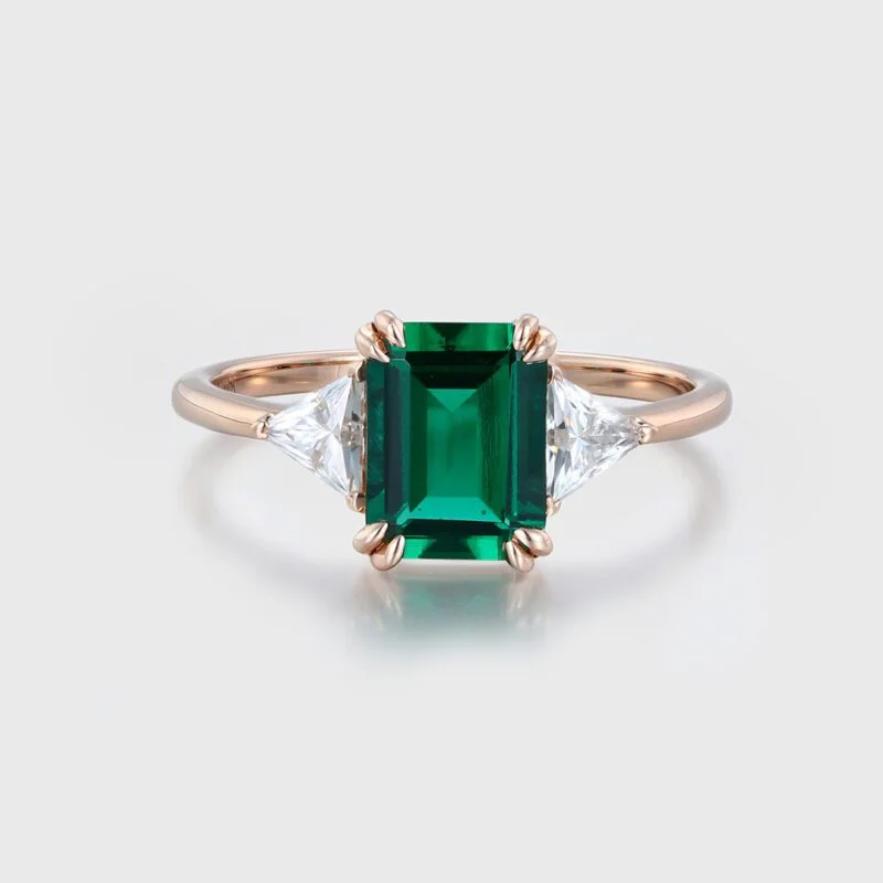 1.5ct Emerald Cut Emerald Three Stone Engagement Ring In 14k Rose Gold.