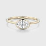 East West Bezel Set 1 Carat Oval Cut Moissanite Solitaire Promise Ring In 14K Yellow Gold