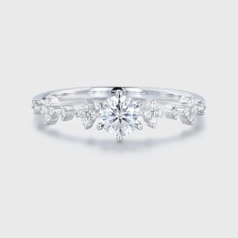 Love Blossoms: 0.5 ct Round Cut Moissanite Anniversary Ring. Embrace the Beauty of a Unique White Gold Flower Ring.