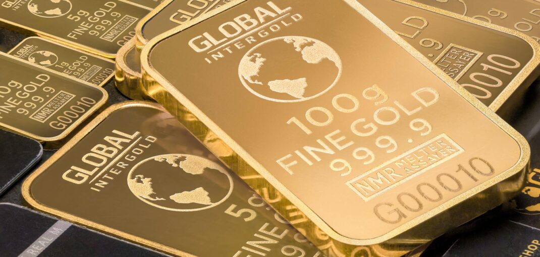 A detailed shot of gold bars labeled 'Global Intergold' as a symbol of wealth and investment.